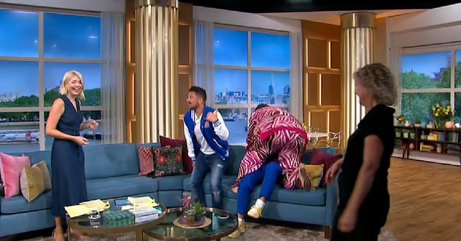 Alison Hammond on This Morning with Holly while mounting Jason