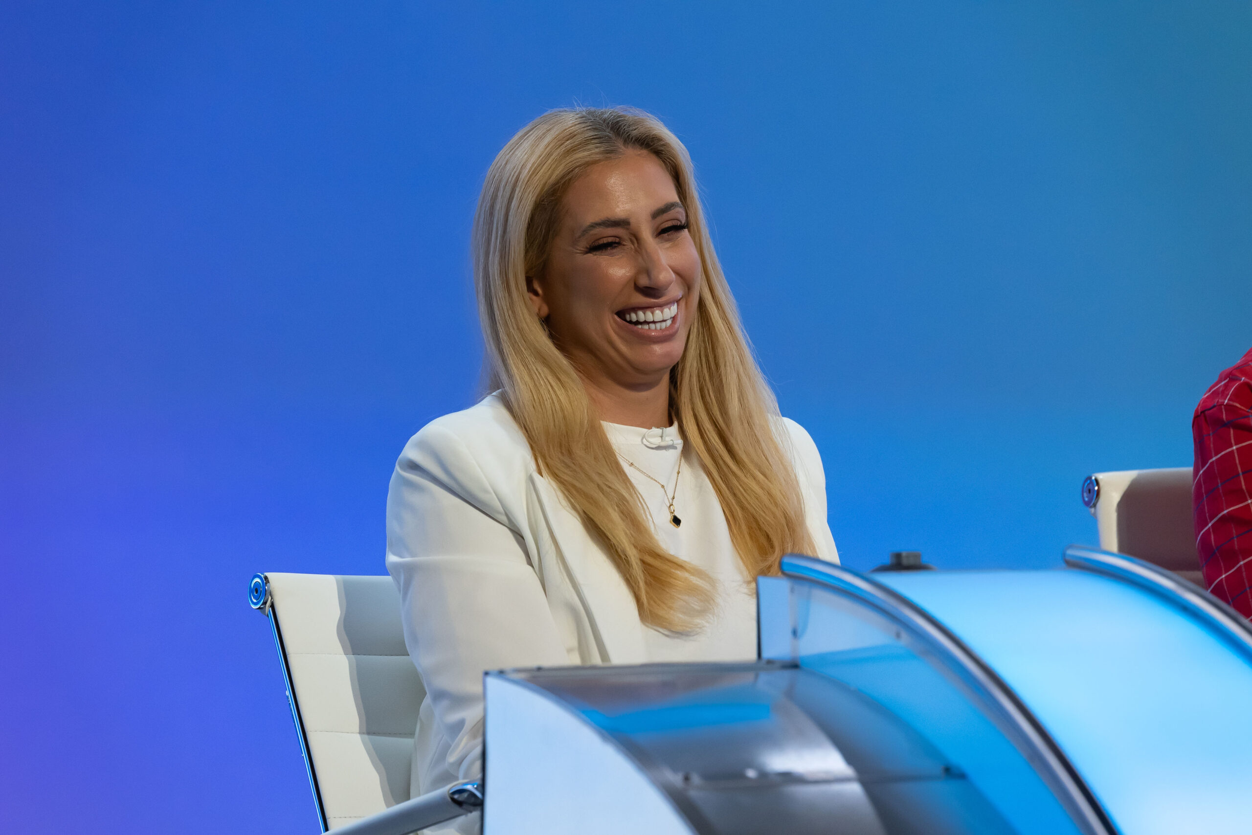 Stacey Solomon smiling on a panel show