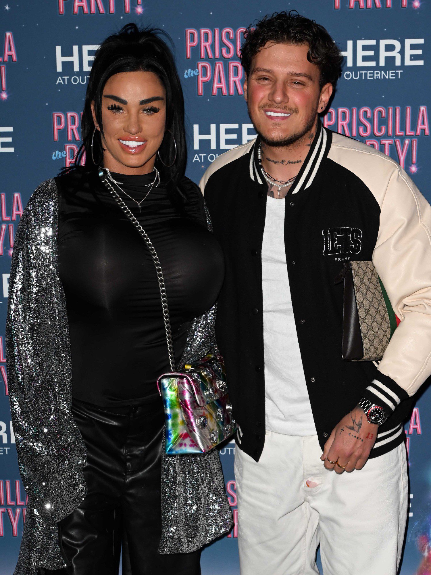 Katie Price smiling with boyfriend JJ Slater at event