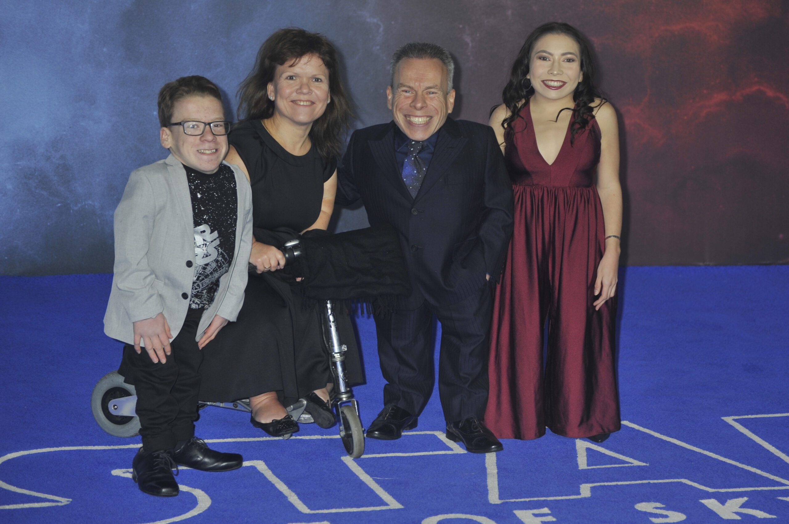 Warwick Davis and his daughter, wife and son