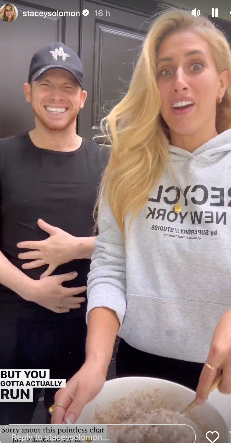 Joe Swash smiling beside Stacey Solomon in their kitchen