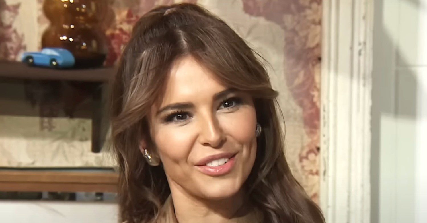 Cheryl smiling during an interview 