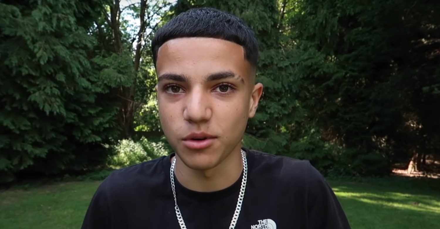 Junior Andre chatting on Youtube in black t-shirt