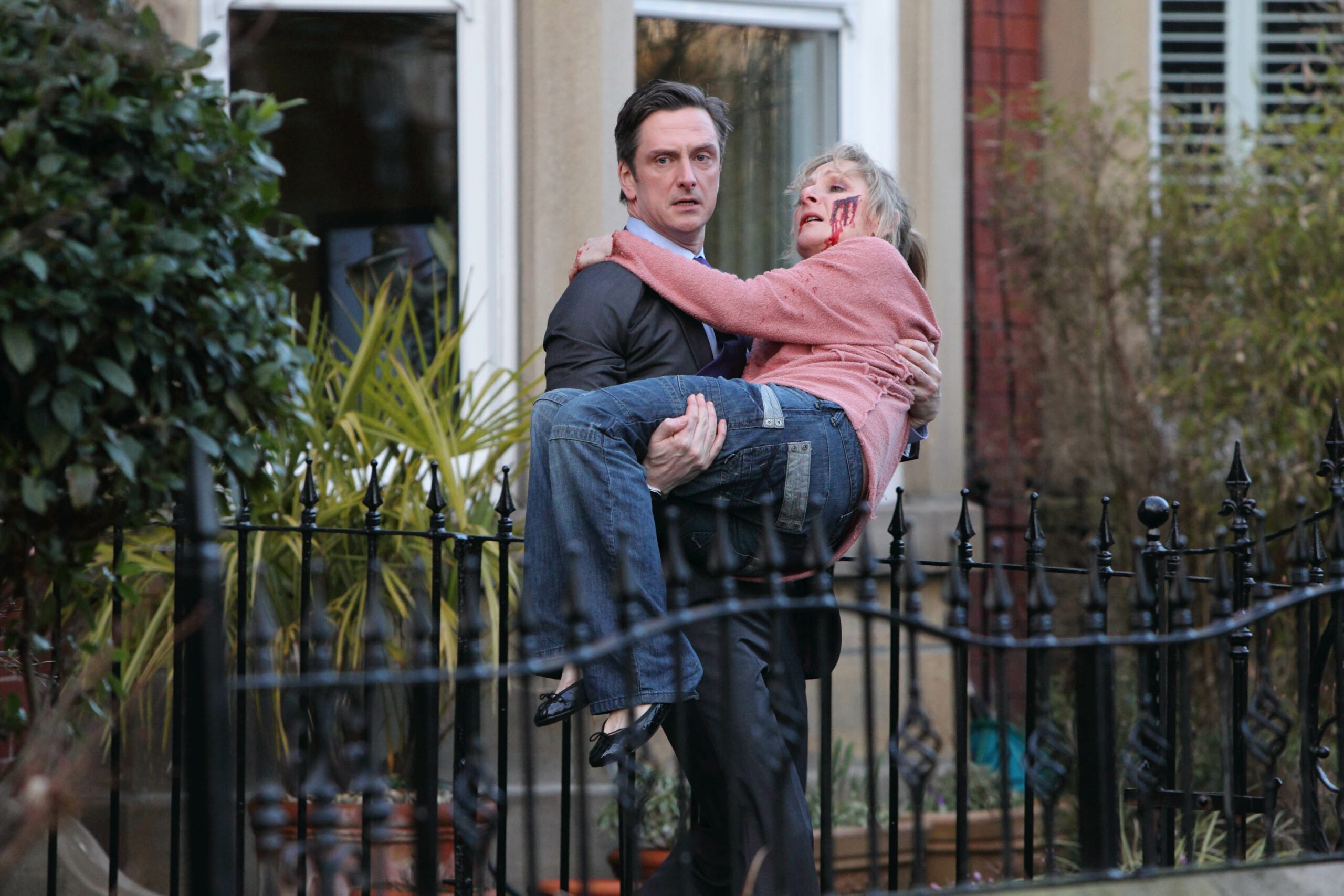 Nicholas Gleaves carrying wife Lesley Sharp on set of Scott and Bailey