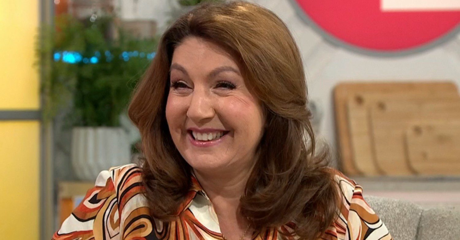 Jane McDonald discusses her tour on Lorraine smiling wearing patterned shirt