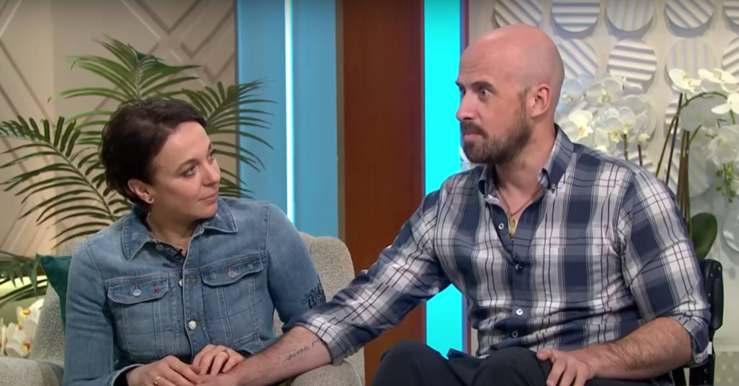 Amanda Abbington hold her partner's hand