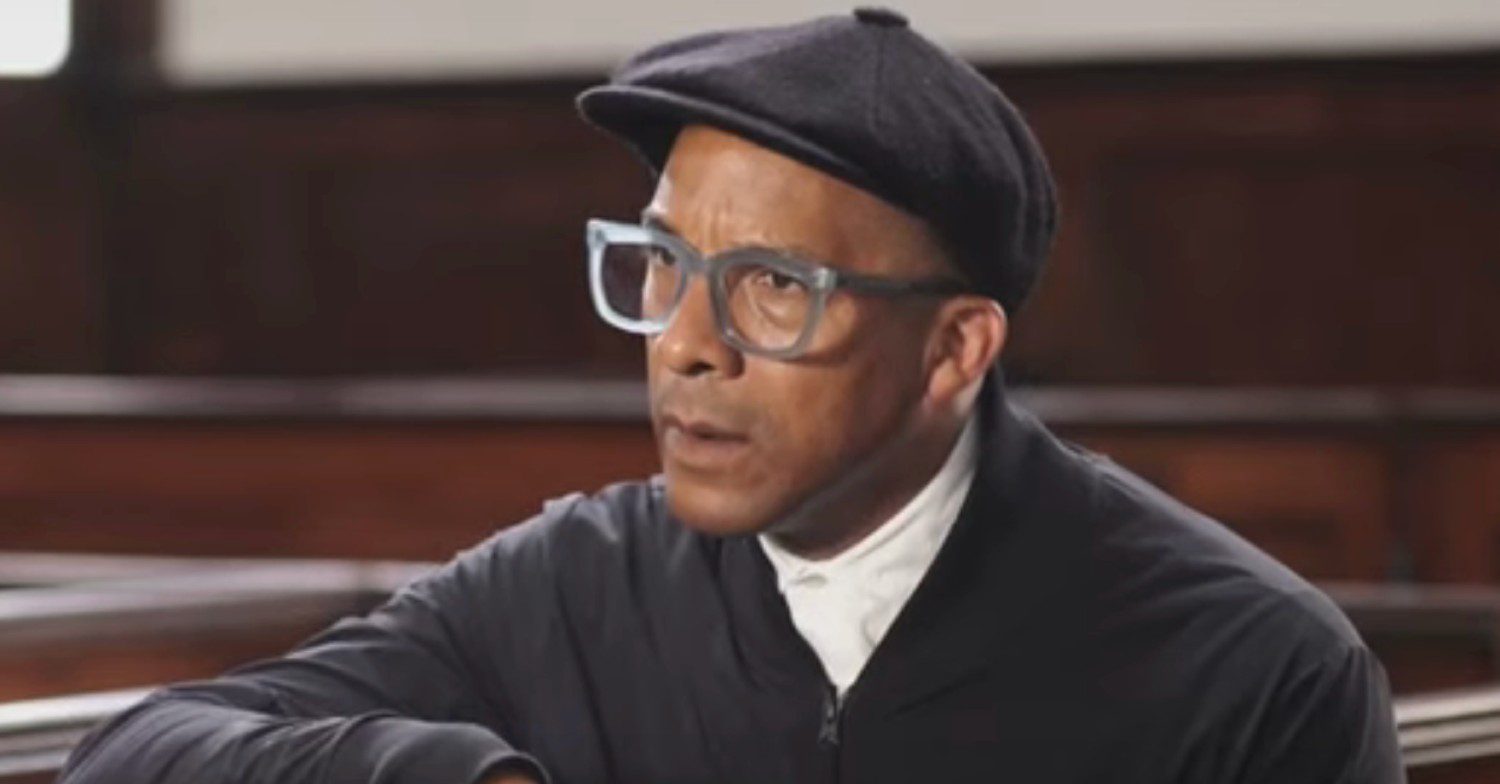 The Repair Shop star Jay Blades looking concerned wearing glasses and a cap