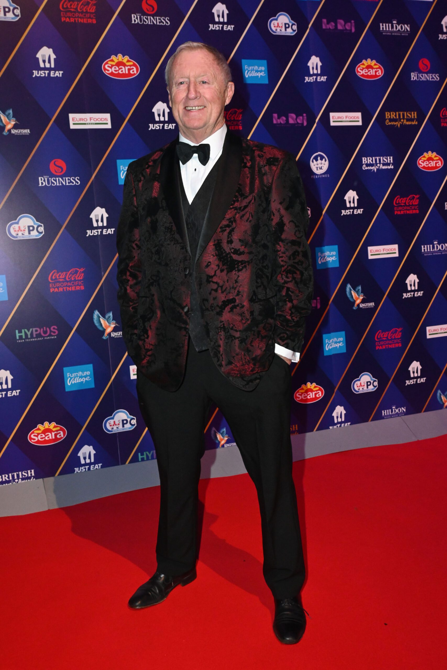 Chris Tarrant smiling on the red carpet