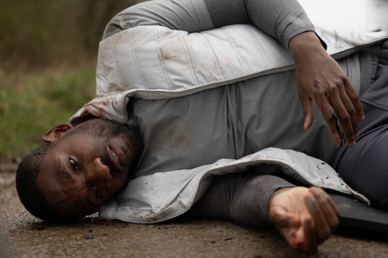 Ethan in Emmerdale lies in the road after being hit by a car