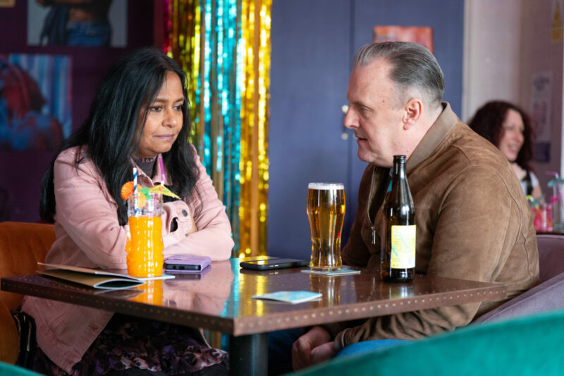 Maya and Harvey look troubled as they talk over drinks in EastEnders
