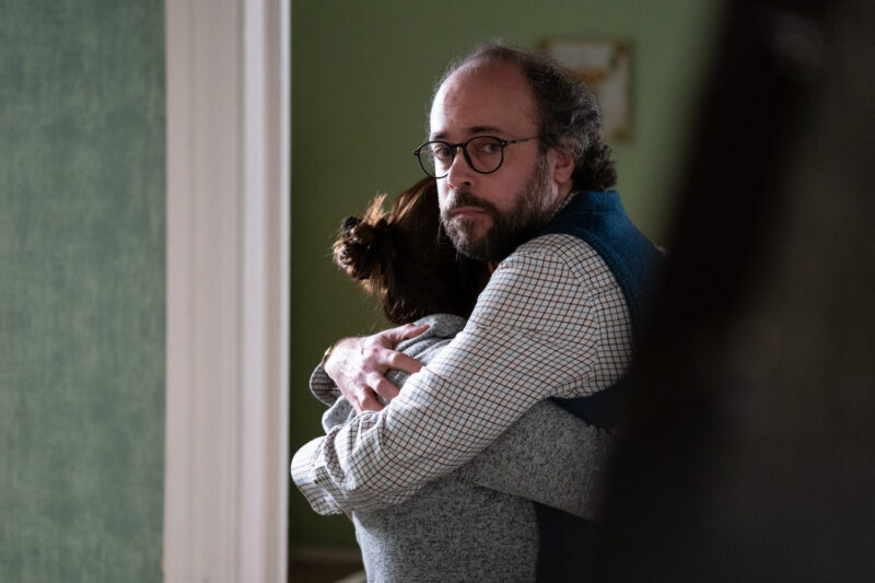 Reiss looks coldly at Bianca as he hugs Sonia in EastEnders