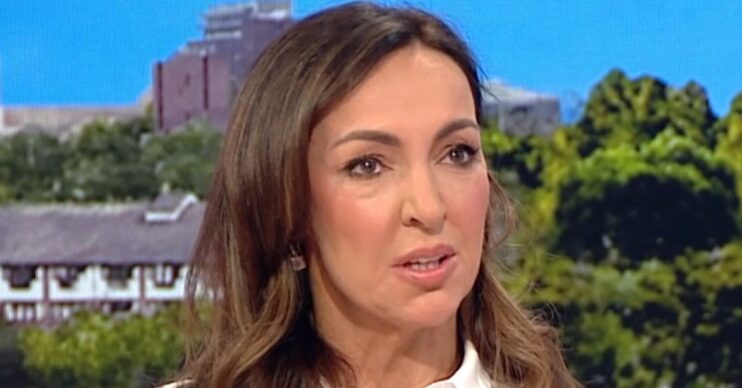 Sally Nugent with emotional expression wearing a white blouse on BBC Breakfast