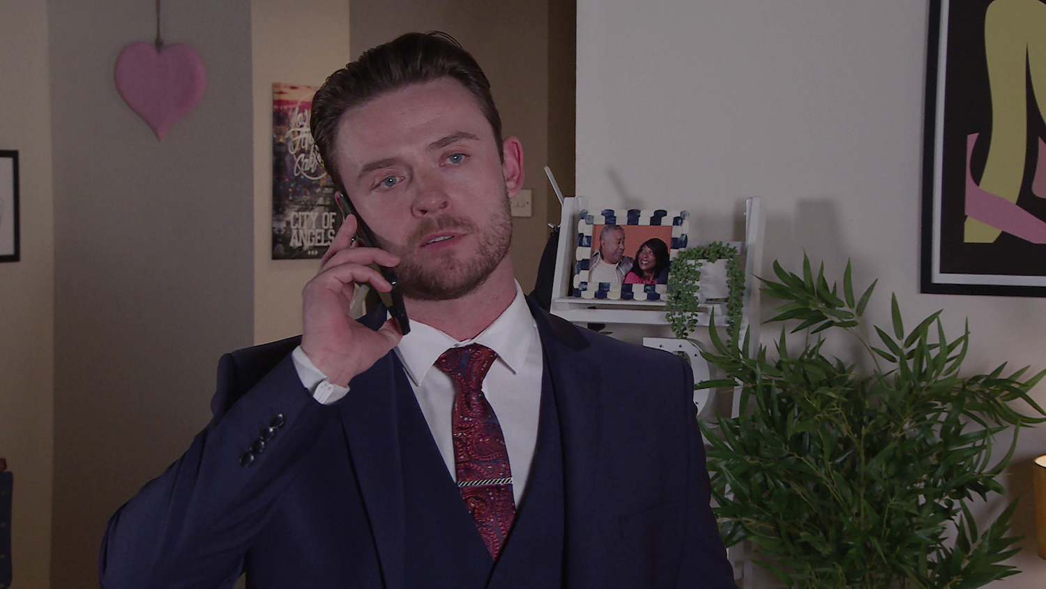 Joel looking shady on the phone in Corrie