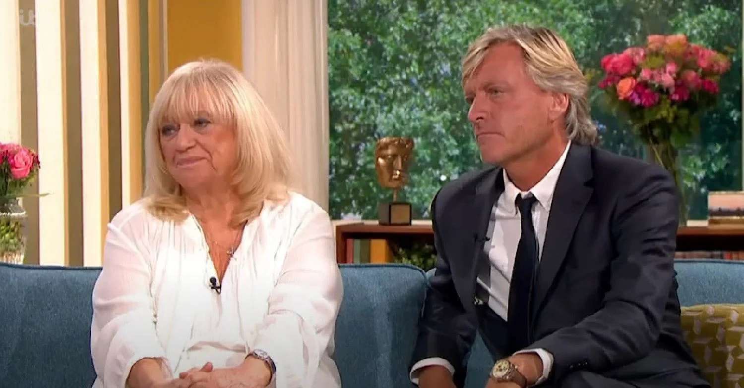 Richard Madeley and Judy Finnigan sat on a sofa talking