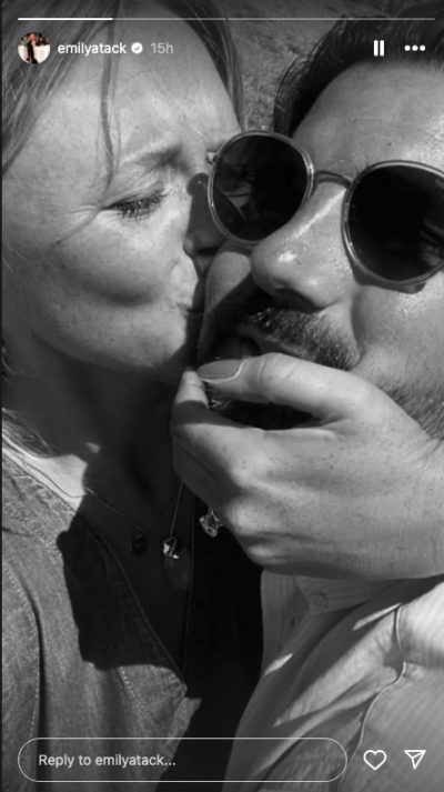 Emily Atack kissing her boyfriend