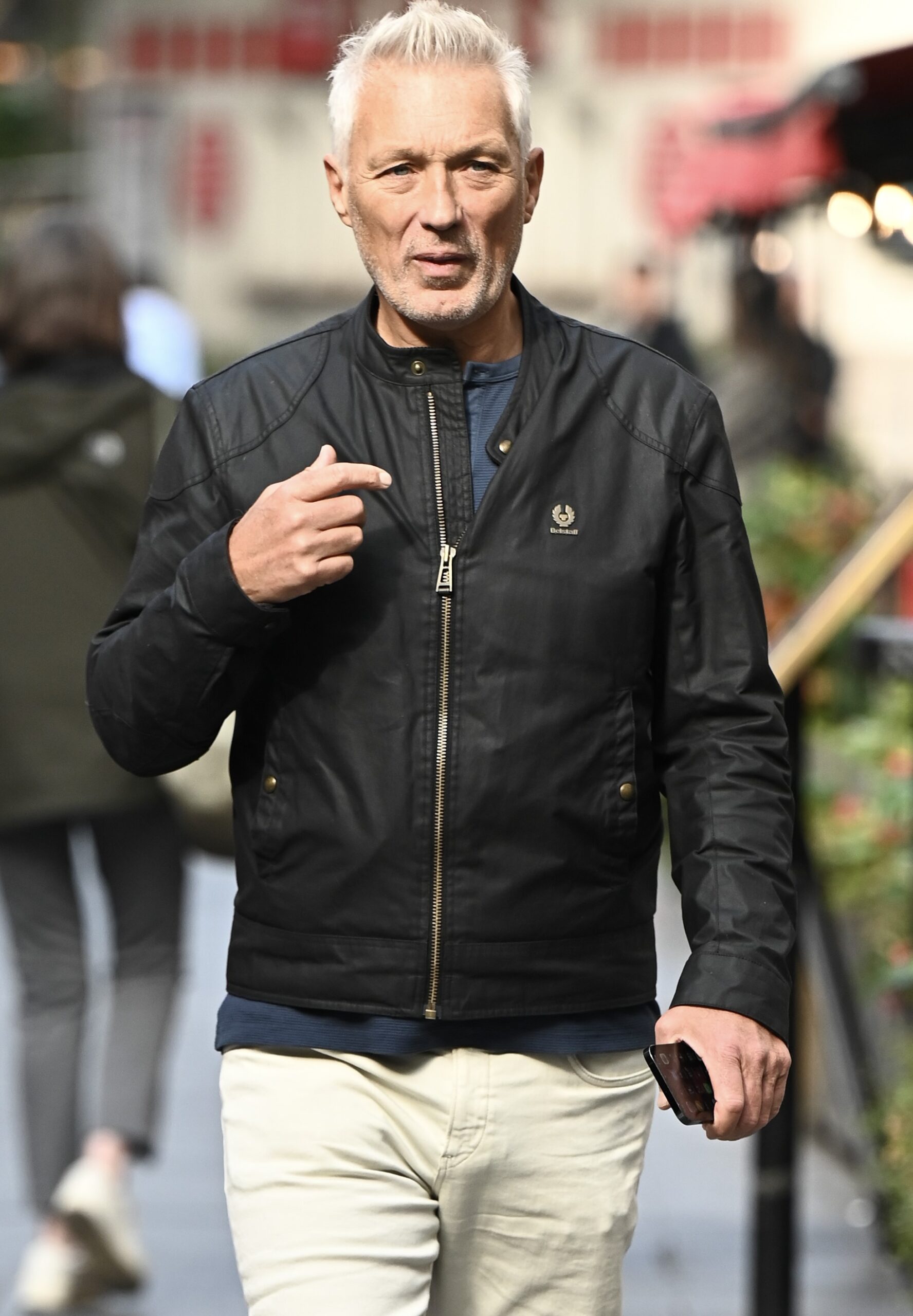 Martin Kemp walking with serious look 