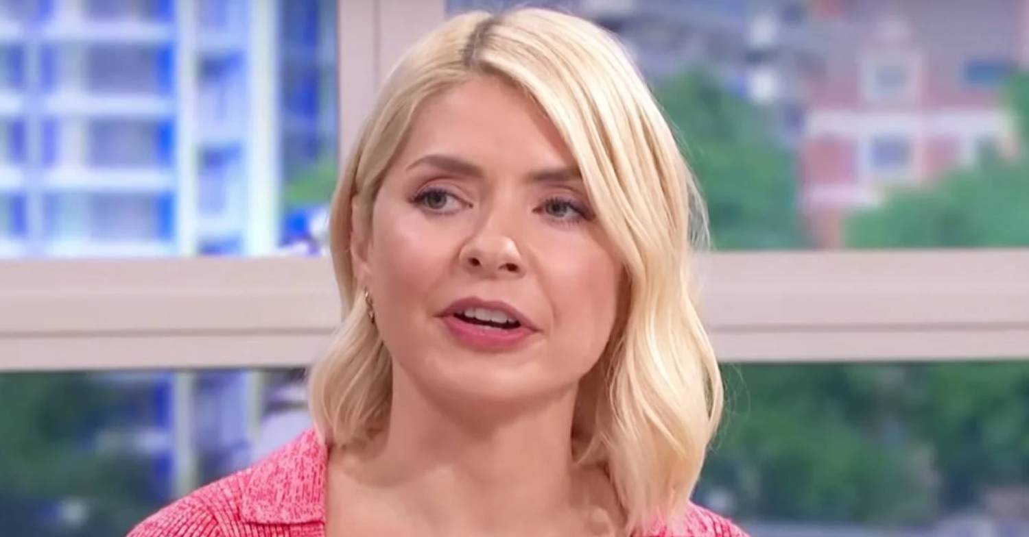 Holly Willoughby peers over
