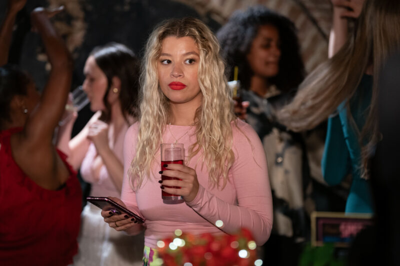 Anna holding a drink on a night out in EastEnders