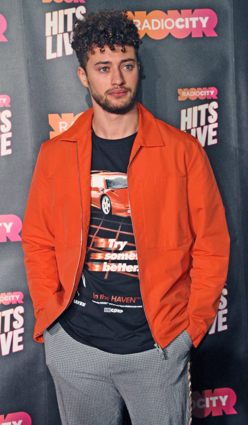 Myles Stephenson wearing an orange jacket