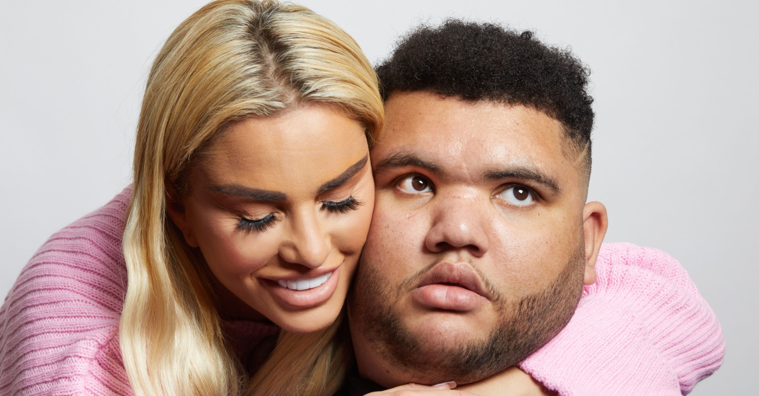 Katie Price smiling and hugging a shocked looking Harvey Price