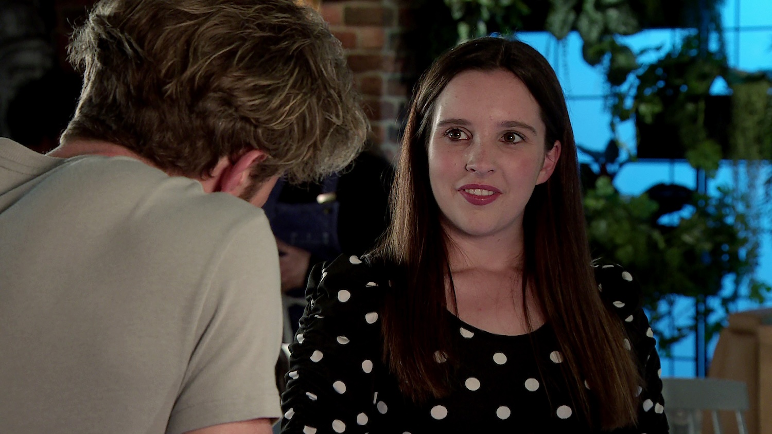 Coronation Street's Amy is talking to Rowan at the Bistro