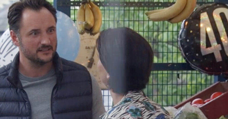 EastEnders' Martin is talking to Eve at the market, next to a 40 balloon