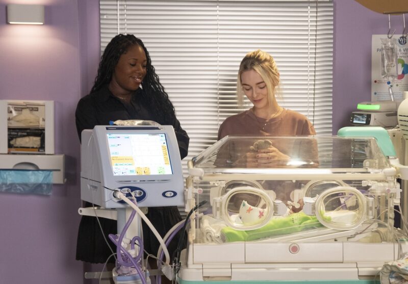 Dee-Dee and laurel smile next to Frankie's incubator