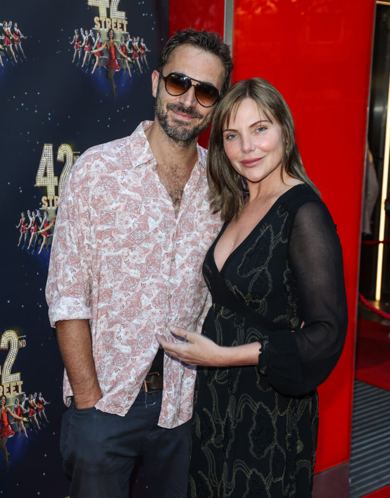 Oliver Farnworth and Samantha Womack cuddle on the red carpet