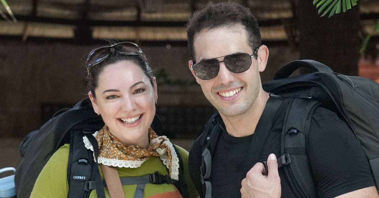 Kelly Brook and husband Jeremy smiling at the camera