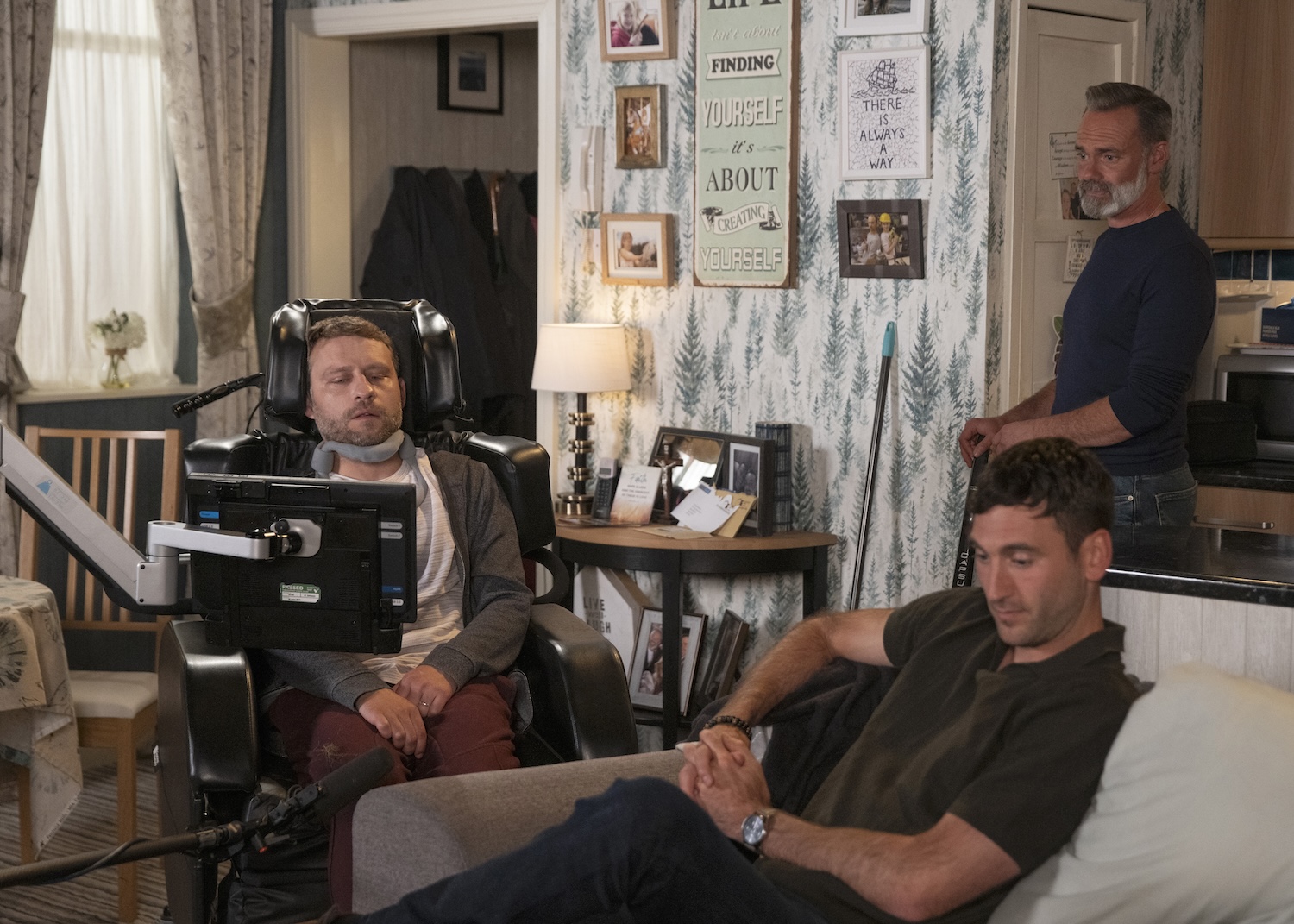 Billy looks on as Paul and Kit talk