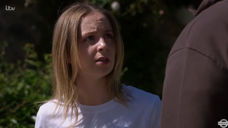 Belle looks shocked on EastEnders