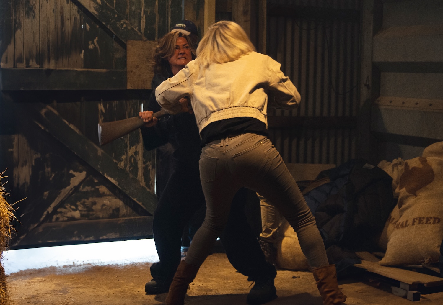 Moira and Ruby wrestle over a gun