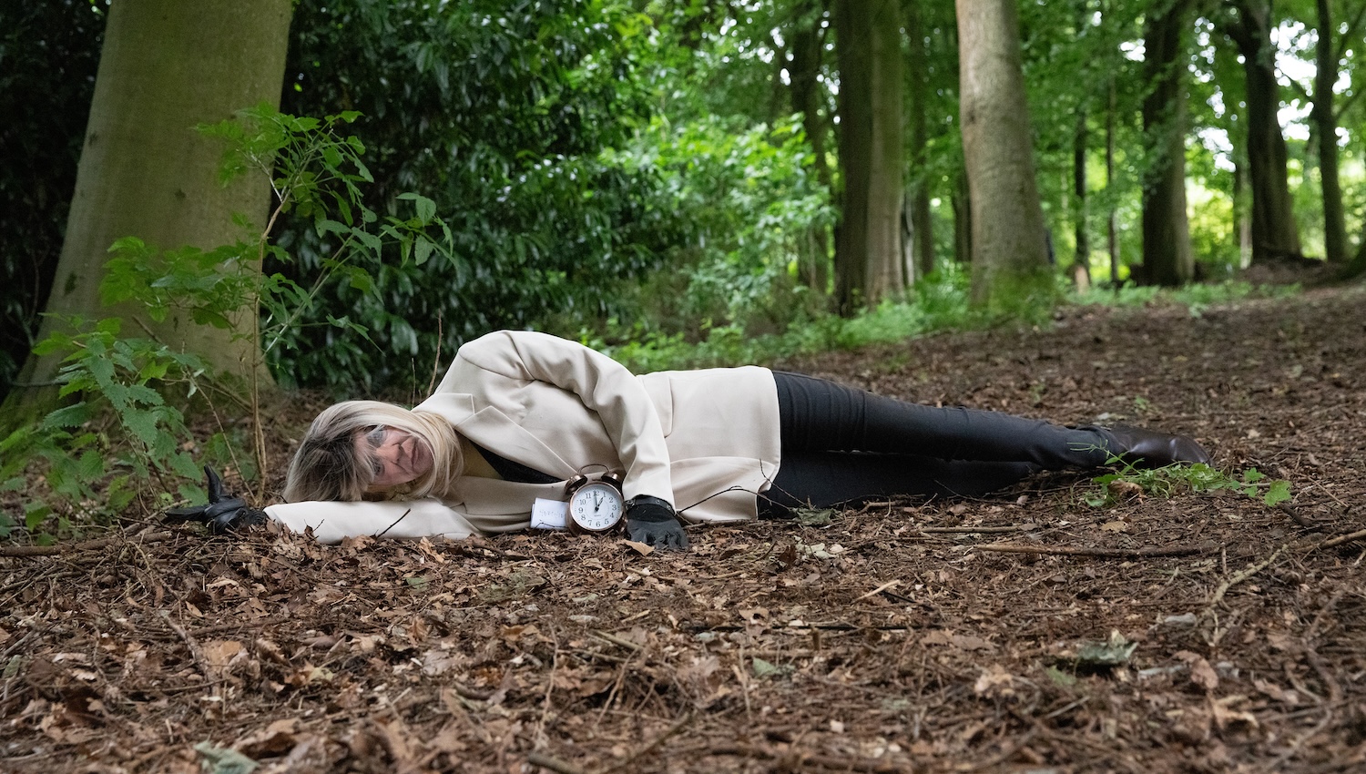 A mannequin in the woods wears Kim's clothes