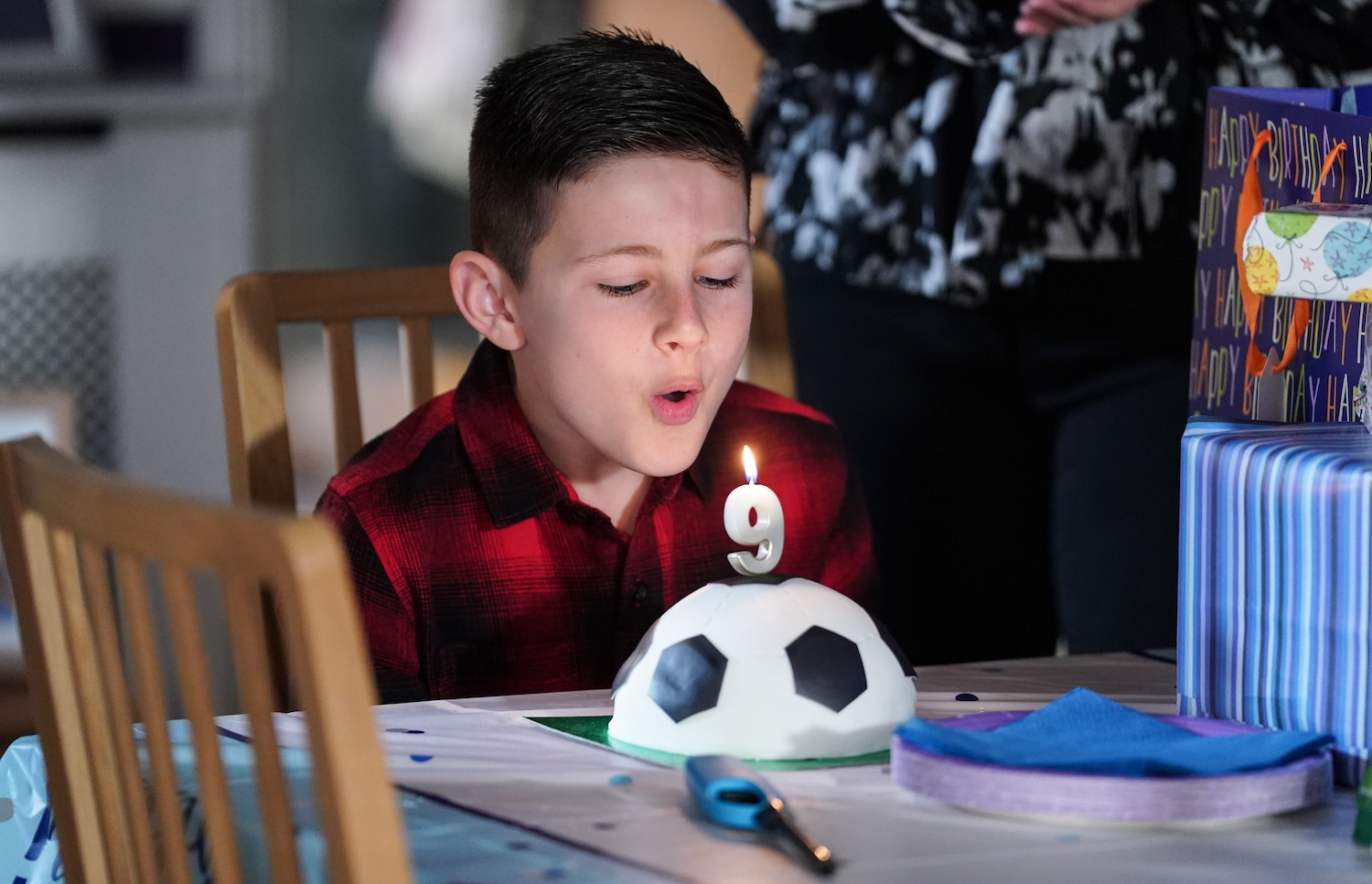 Lauren and Peter's son, Louie Beale blows out his birthday candle