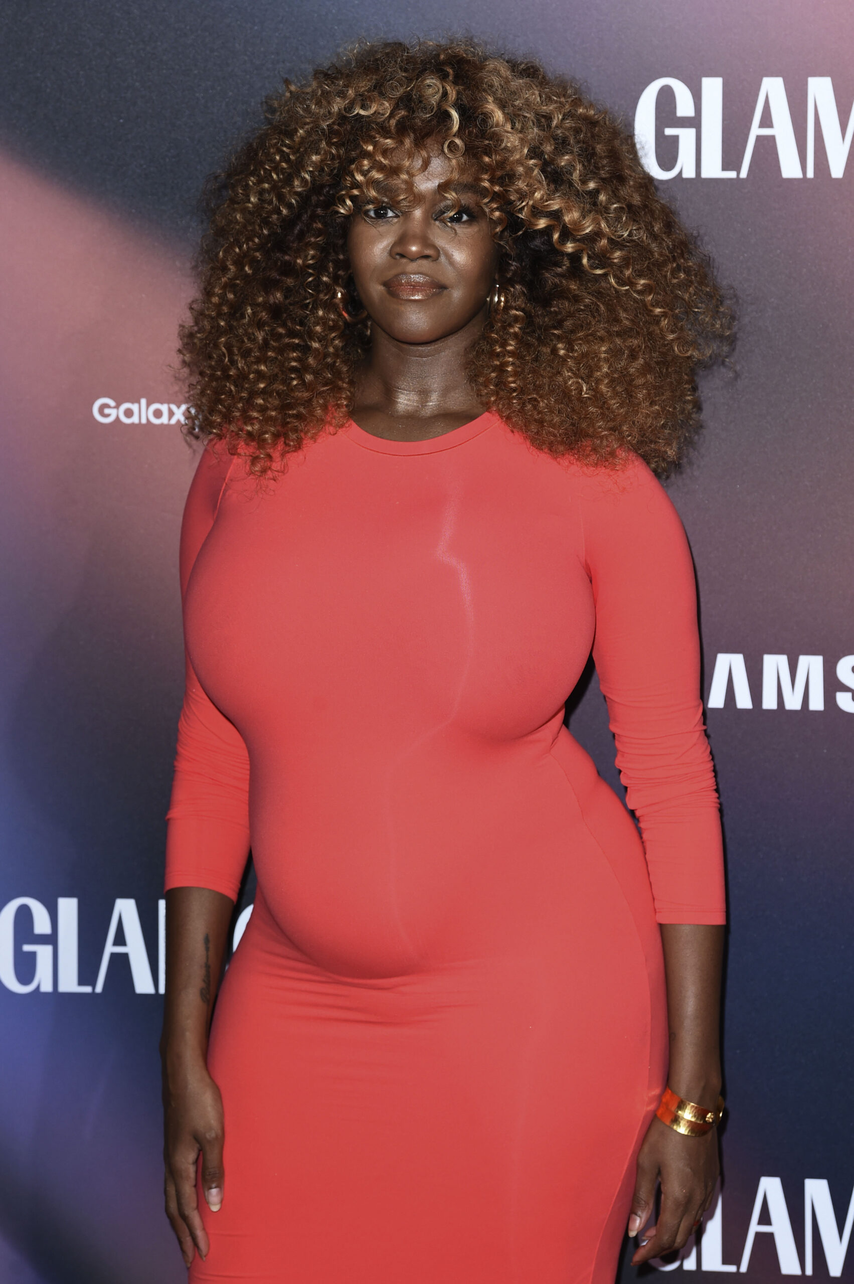 Oti Mabuse in red dress at event