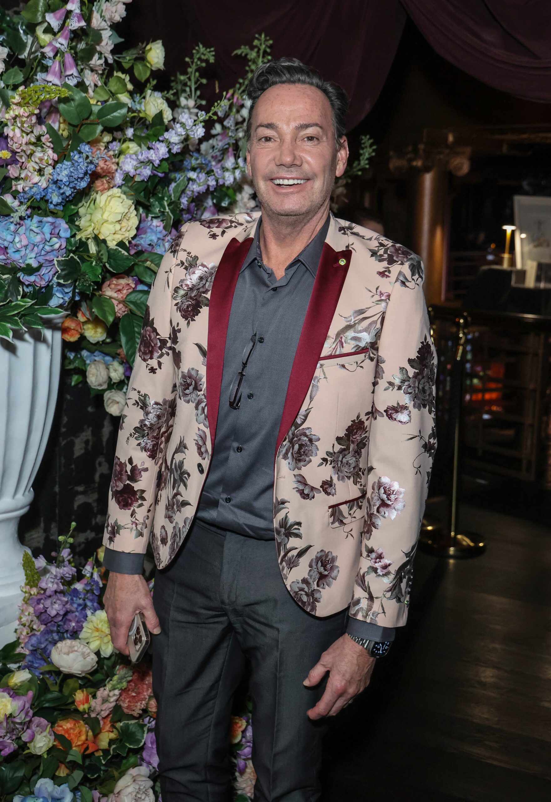 Craig Revel Horwood smiling at event