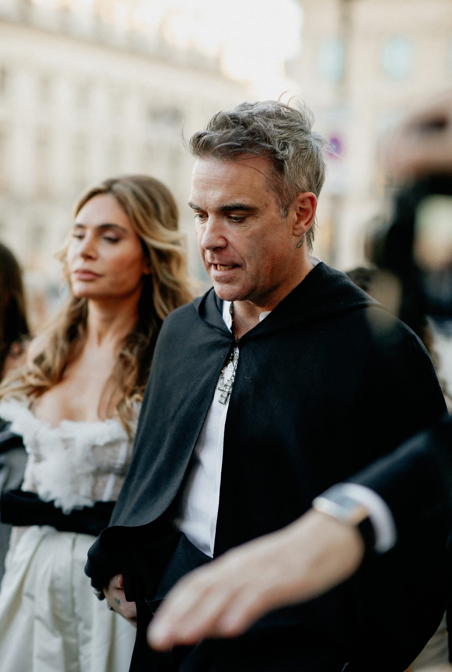 Ayda Field and Robbie Williams look downcast at event