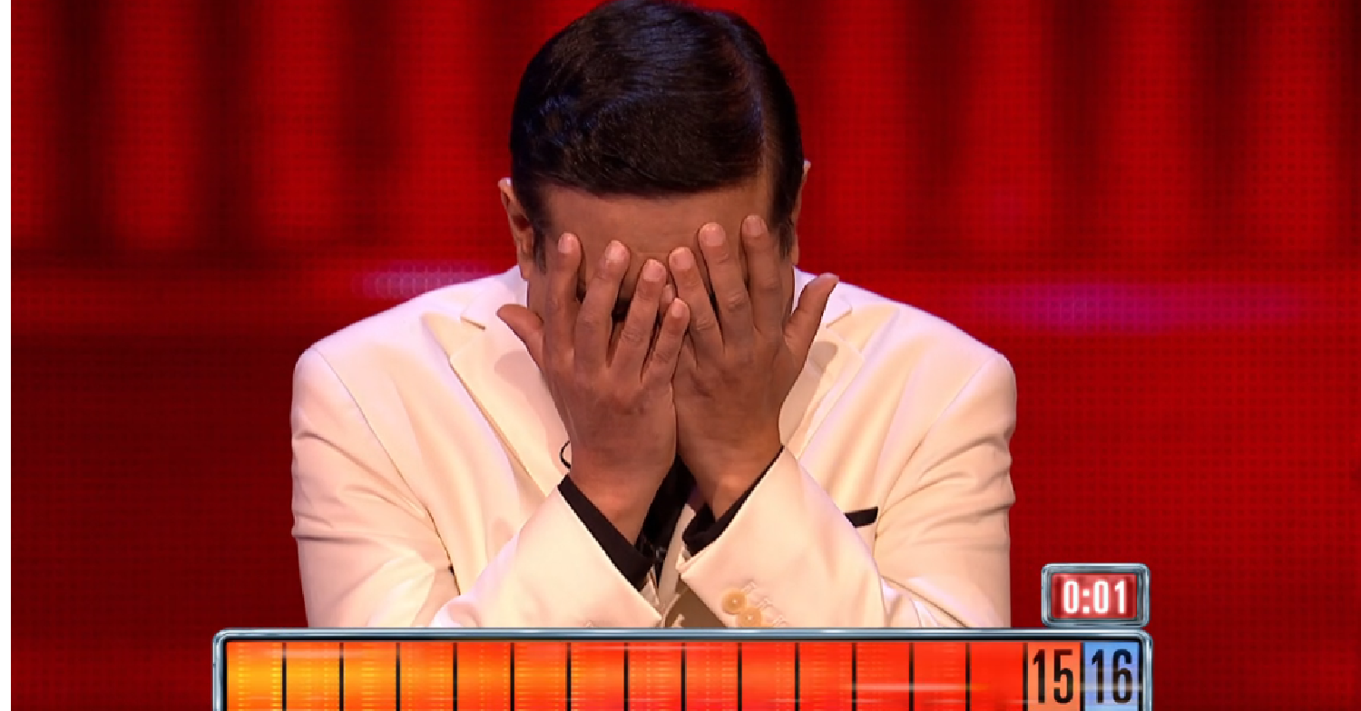 Paul Sinha with his head in his hands on The Chase