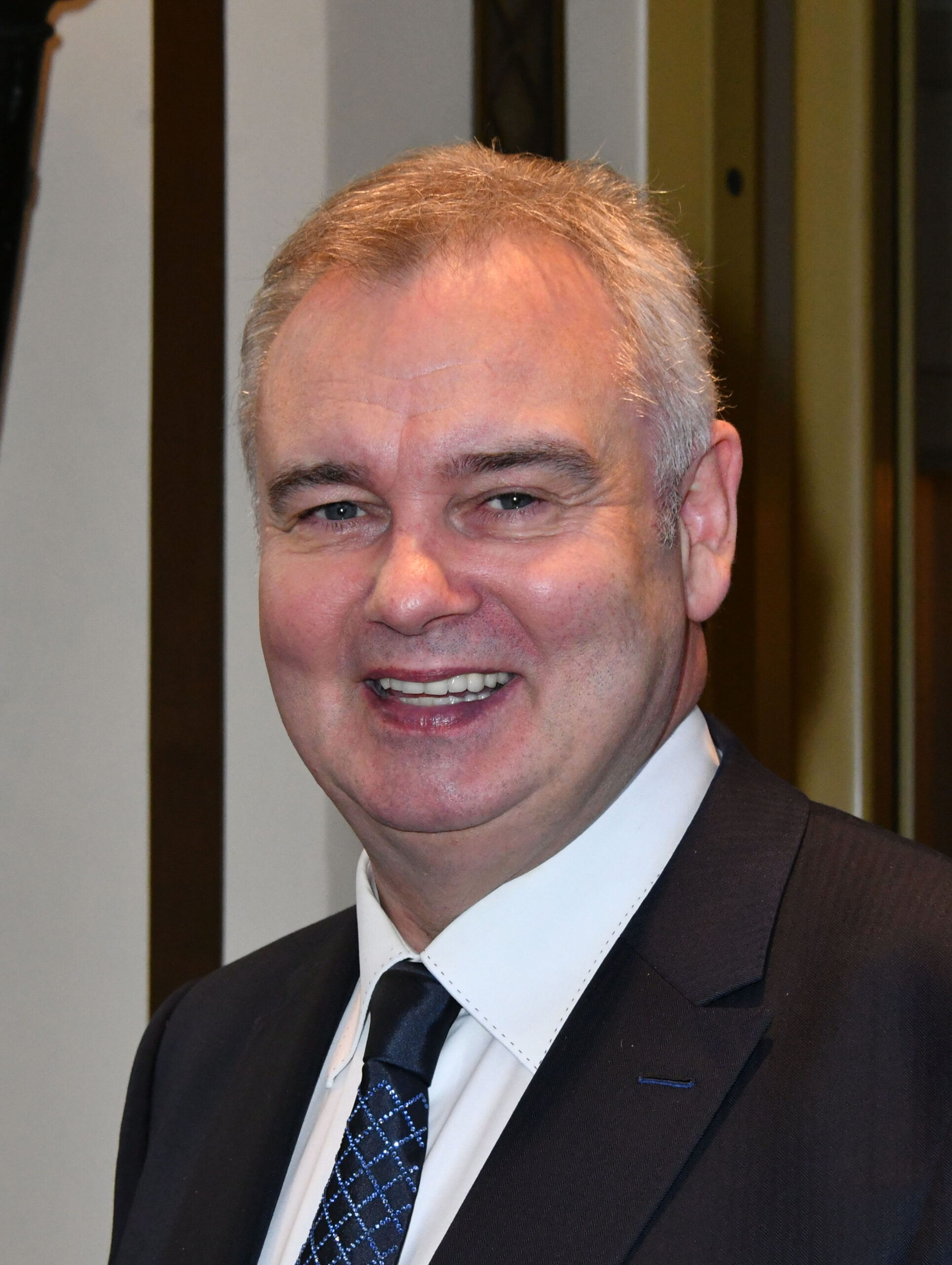 Eamonn Holmes smiling at event