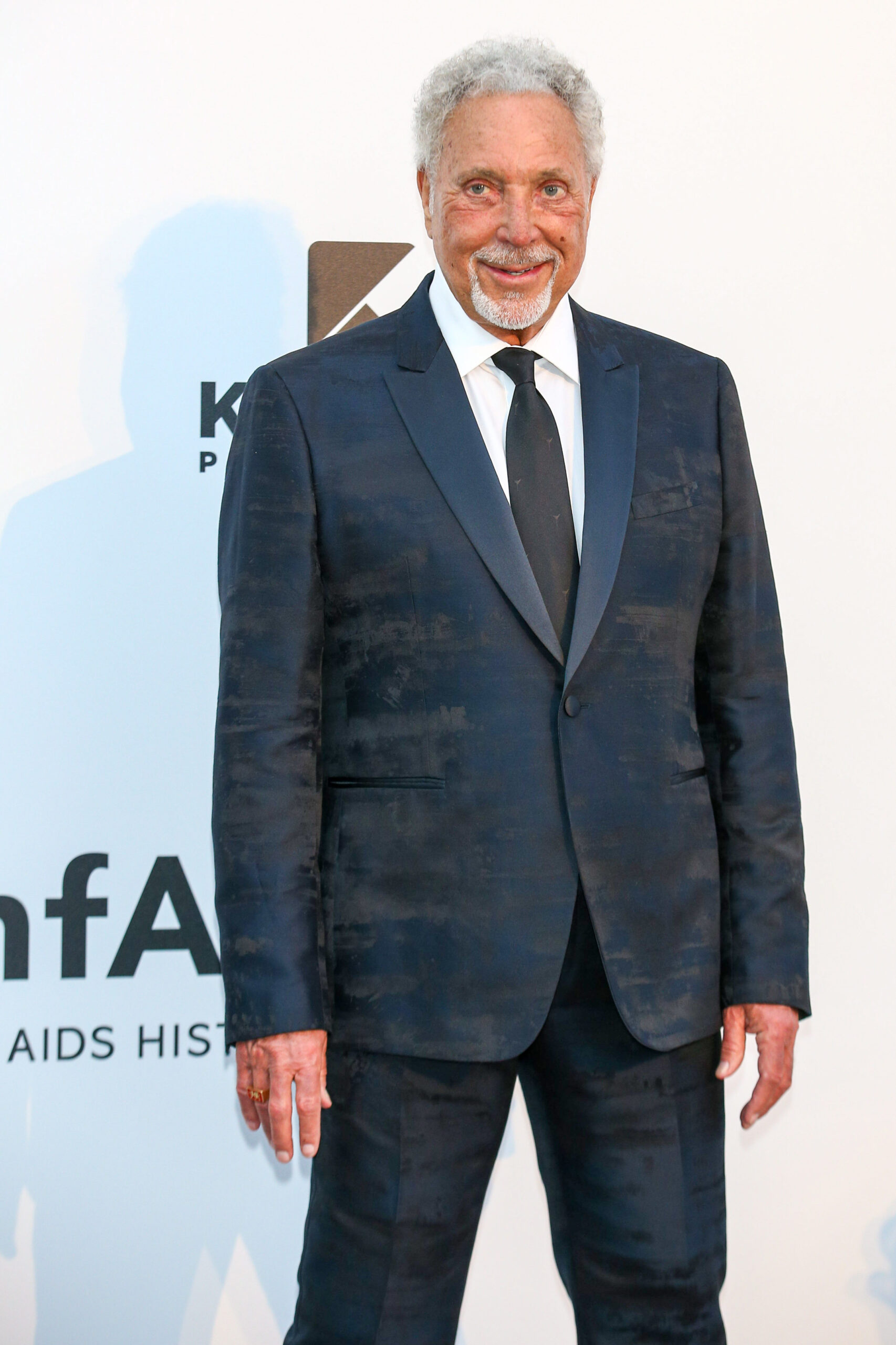 Tom Jones smiling on the red carpet