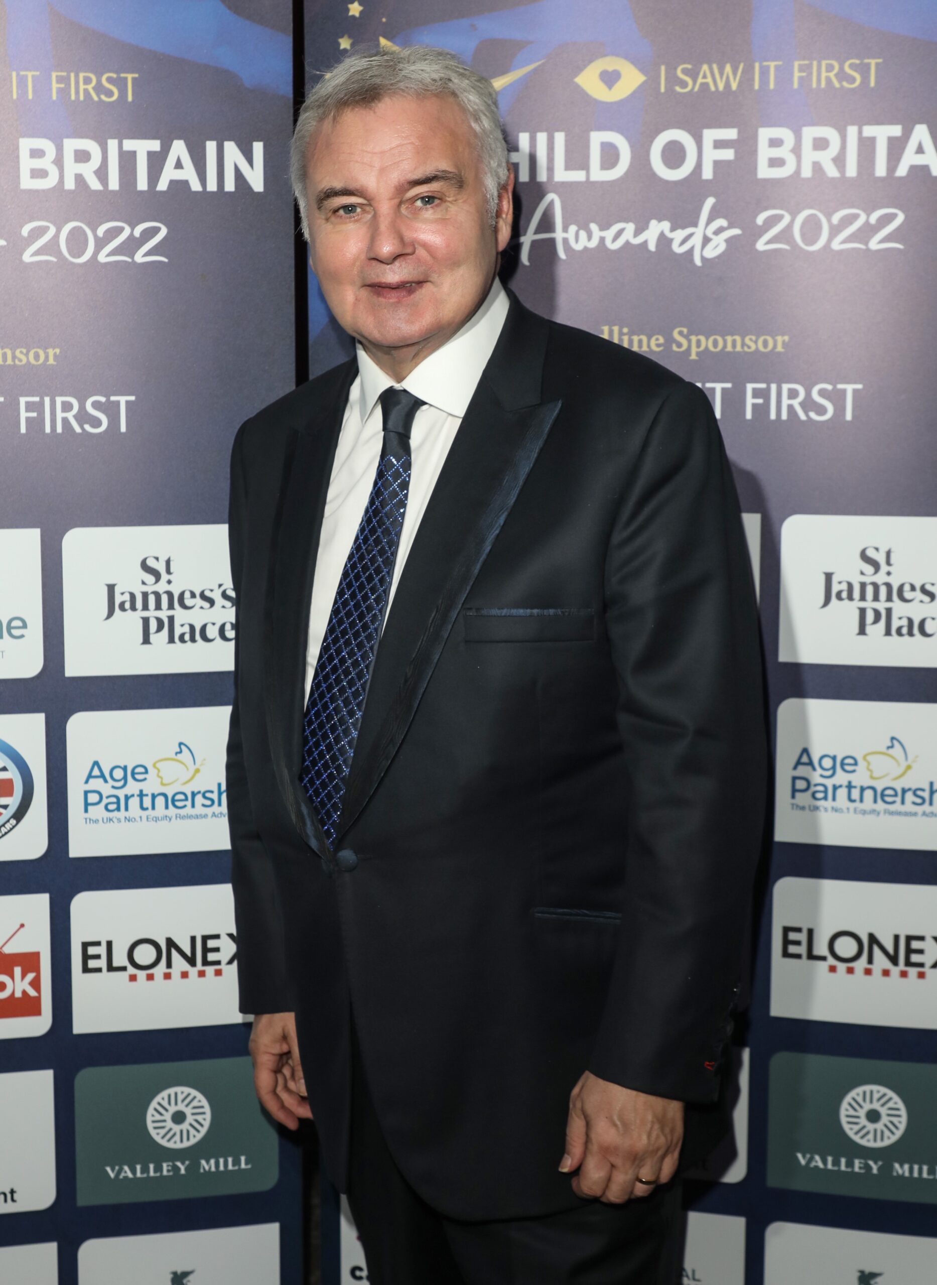 Eamonn Holmes smiling at event