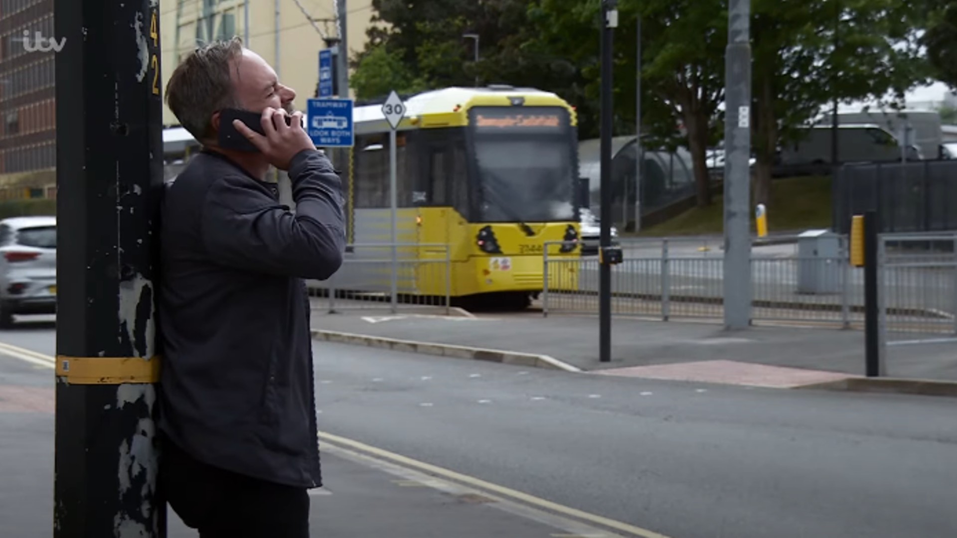 Billy on the phone in Corrie