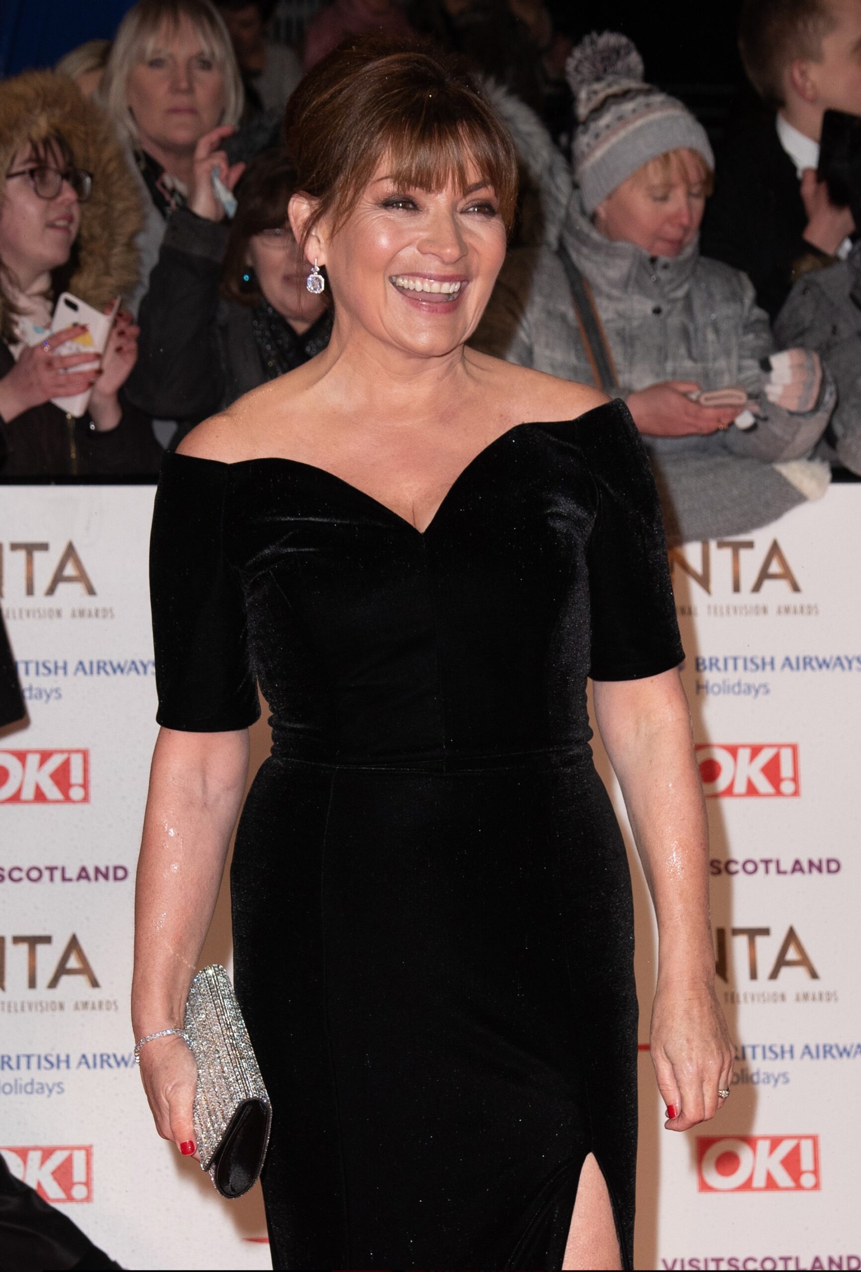Lorraine Kelly smiling in black dress at the NTAs