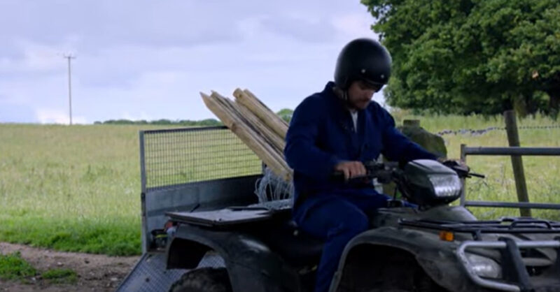 Emmerdale's Mack is on a quadbike with a helmet on
