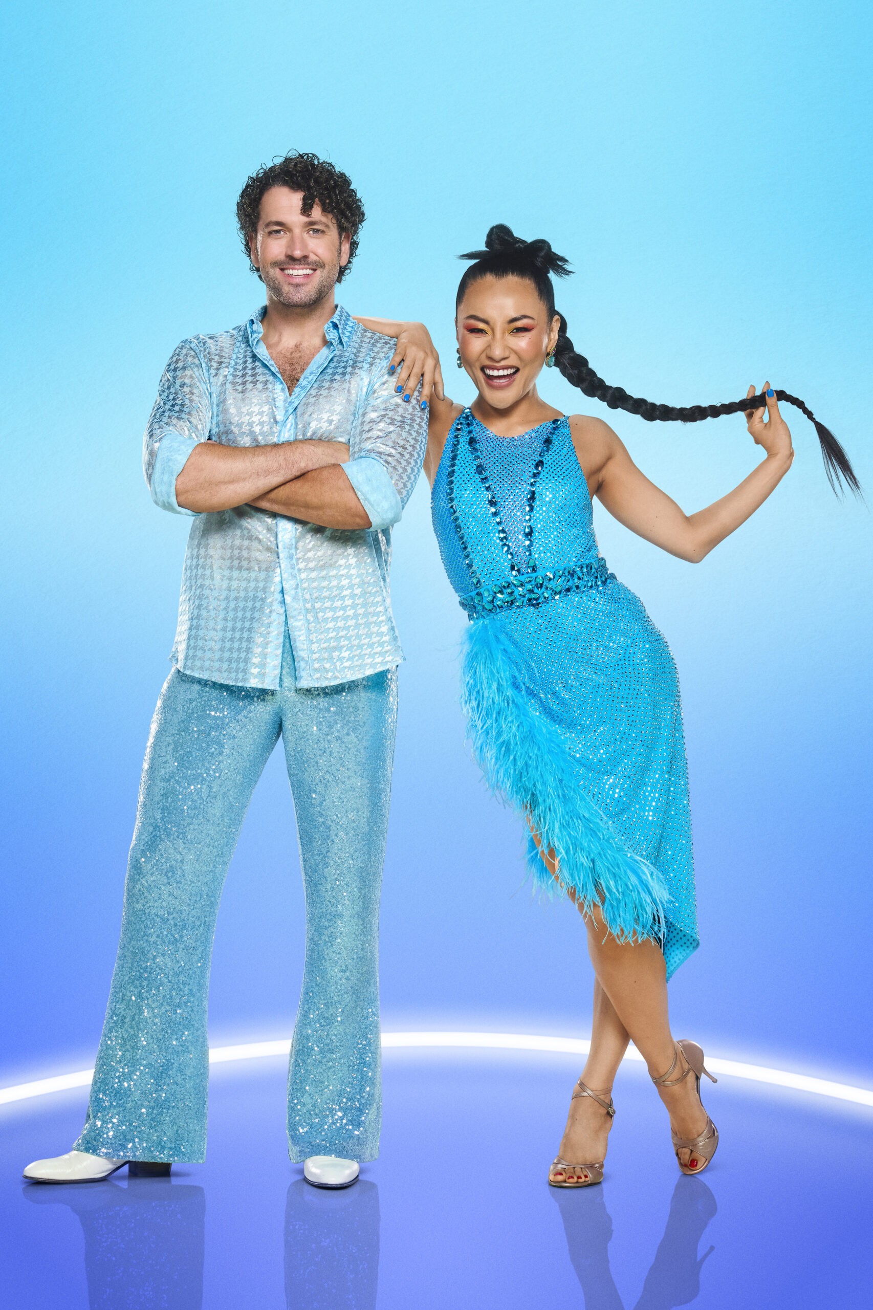 Shayne Ward and Nancy Xu against a blue background on Strictly
