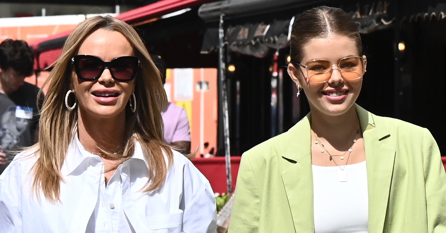 Amanda Holden smiling wearing sunglasses beside her daughter Lexi