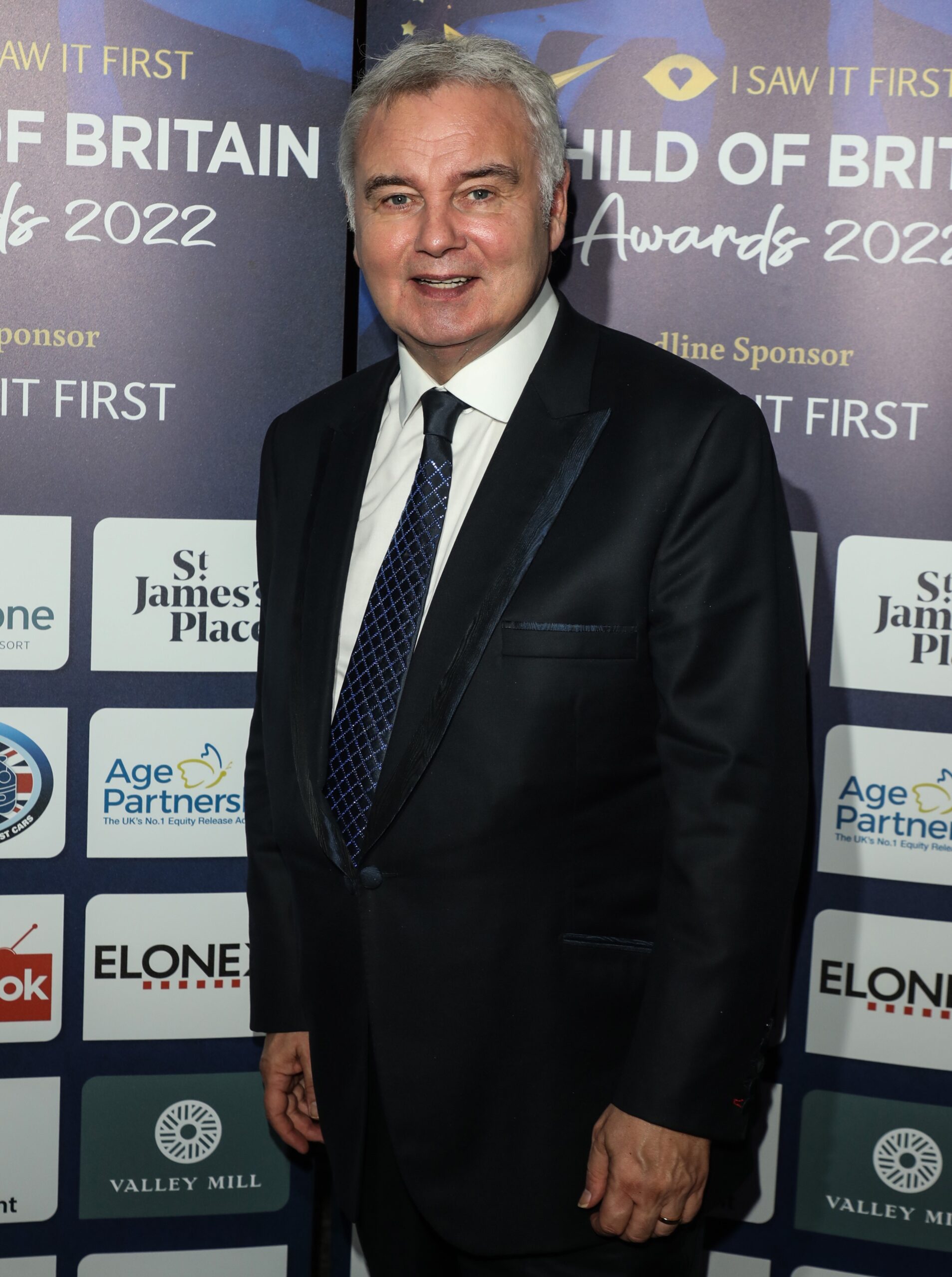 Eamonn Holmes smiling at event