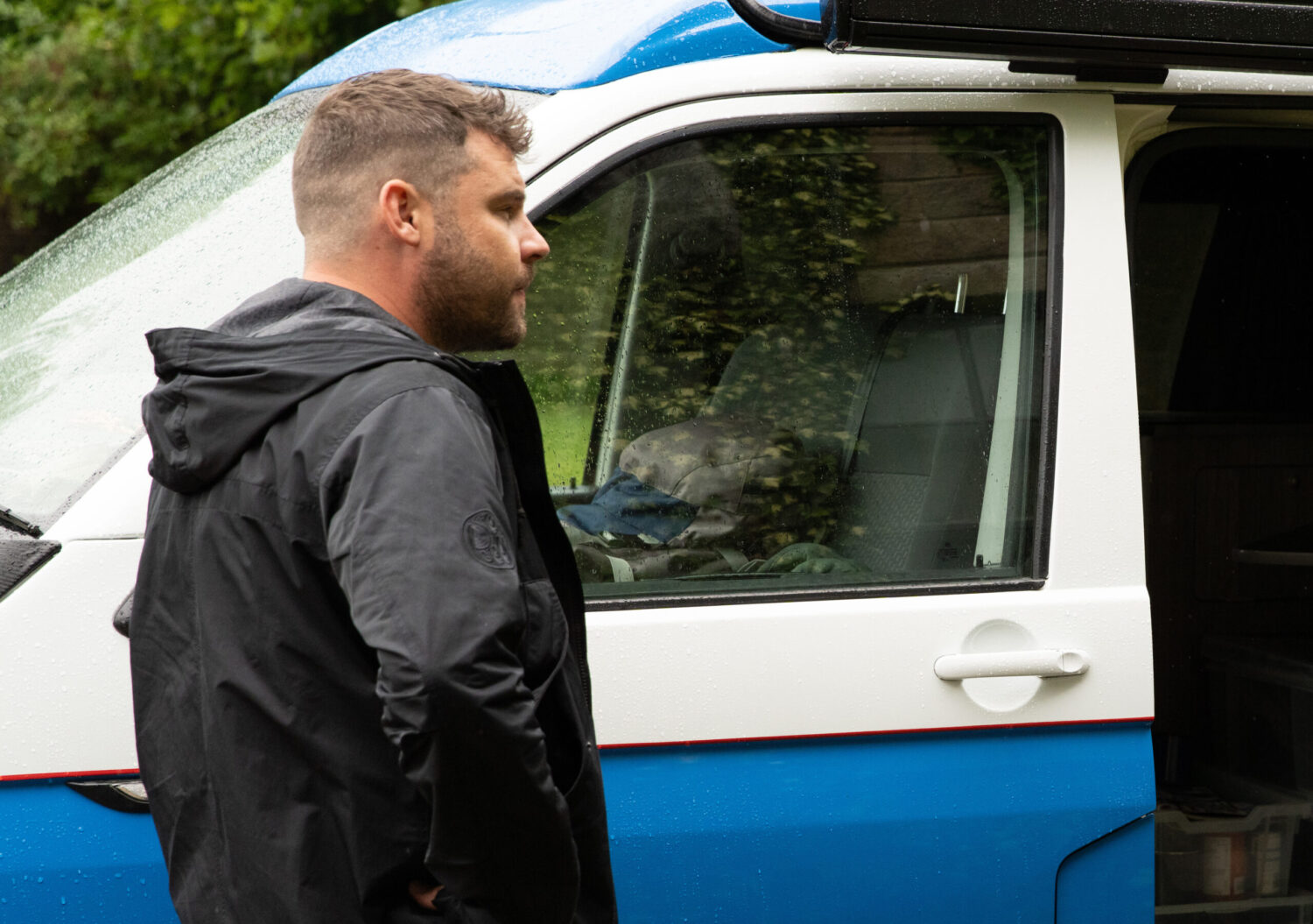 Aaron looks in his van in Emmerdale