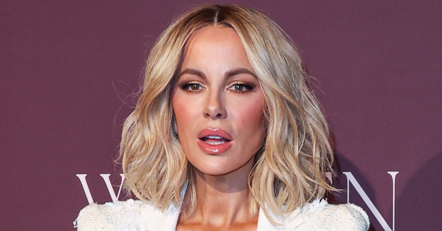 Kate Beckinsale with mouth slightly open as she poses for a photo