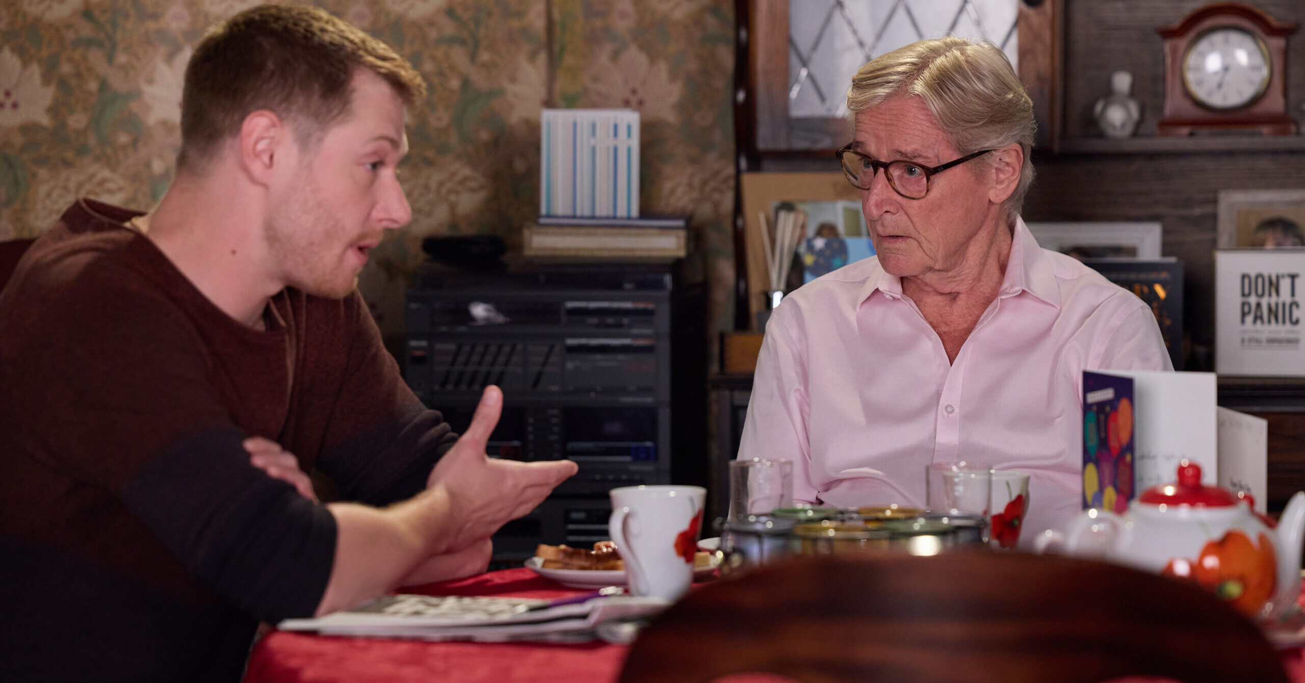 Ken is talking to Daniel